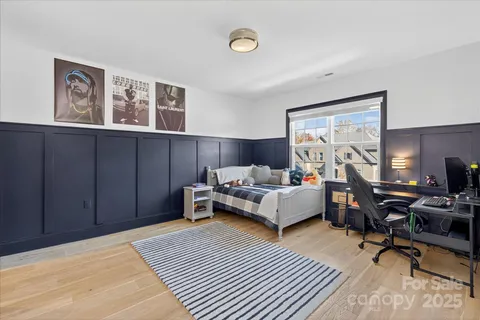 a bedroom with a bed and a table in it