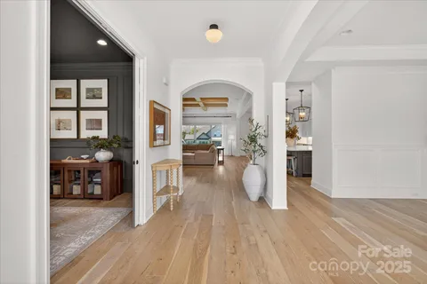 a view of living room with furniture and wooden floor