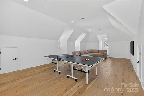 a room with furniture and wooden floor