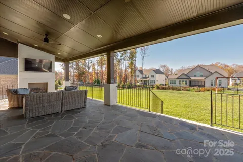 a view of swimming pool with seating space and furniture