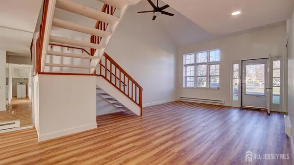 wooden floor in an empty room with a window and wooden floor