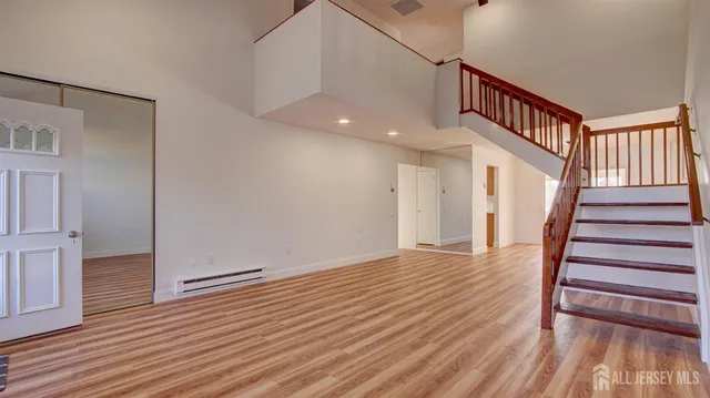 a view of entryway with wooden floor
