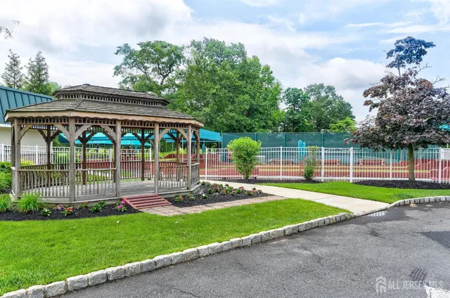 a view of a house with a yard and a garden