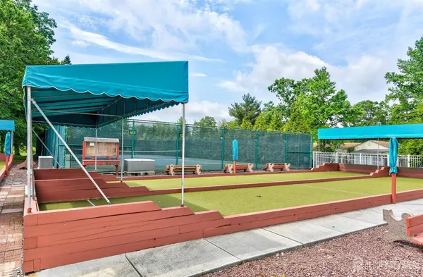 a view of a swimming pool with a yard