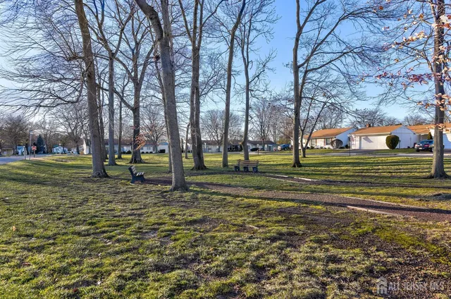 a view of a swimming pool with an outdoor space and seating area