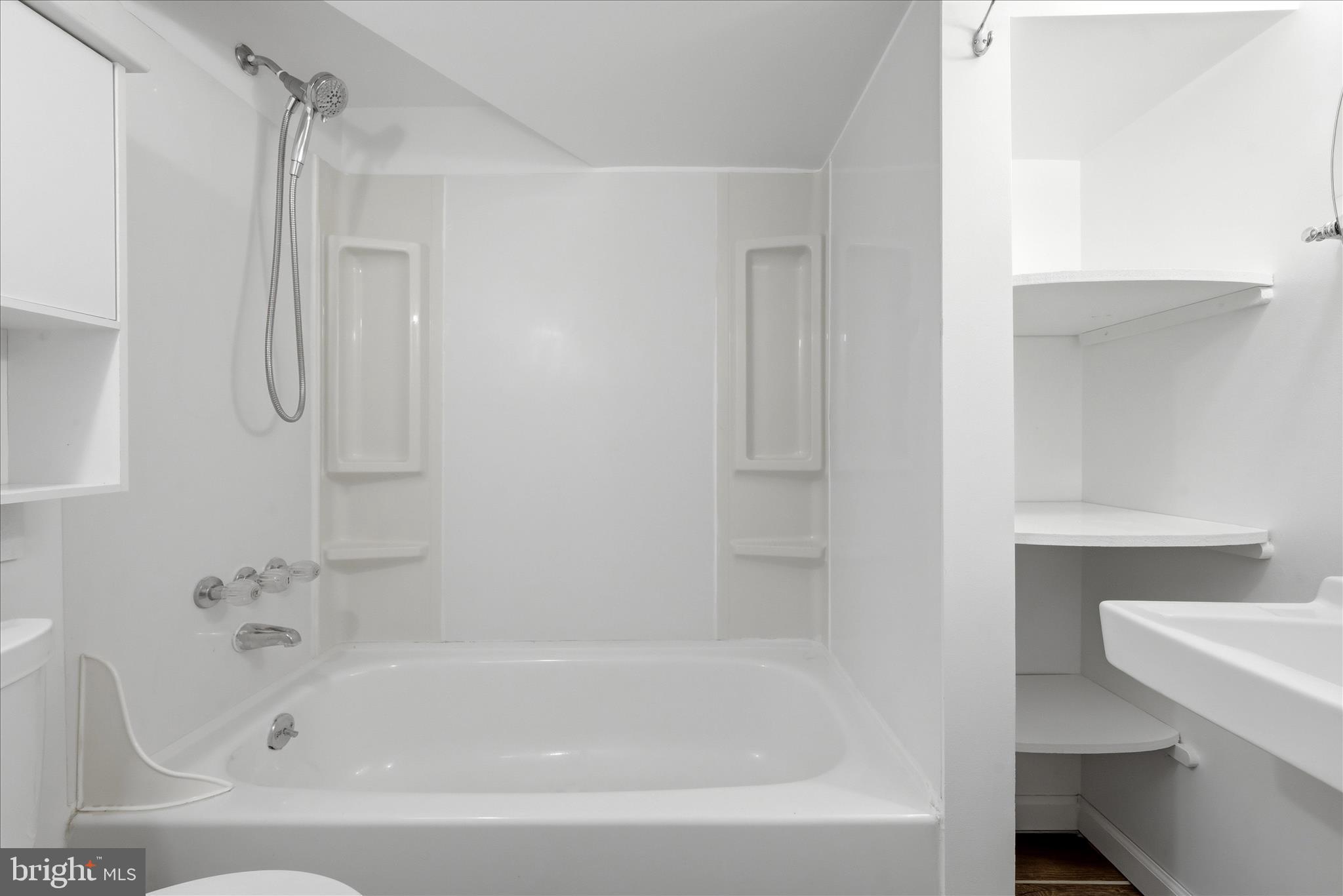 5446 Lighthouse Lane Burke, VA 22015 - Photo 24 of 36 a bathroom with a bathtub and a shower