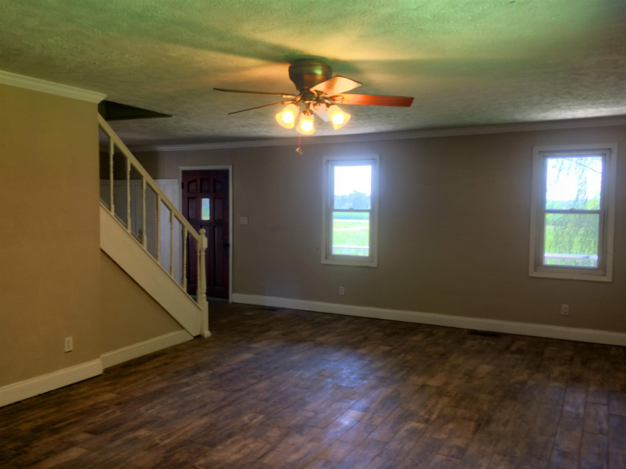 3525 Rossview Road Clarksville, TN 37043 - Photo 18 of 18 a view of an empty room with window and wooden floor