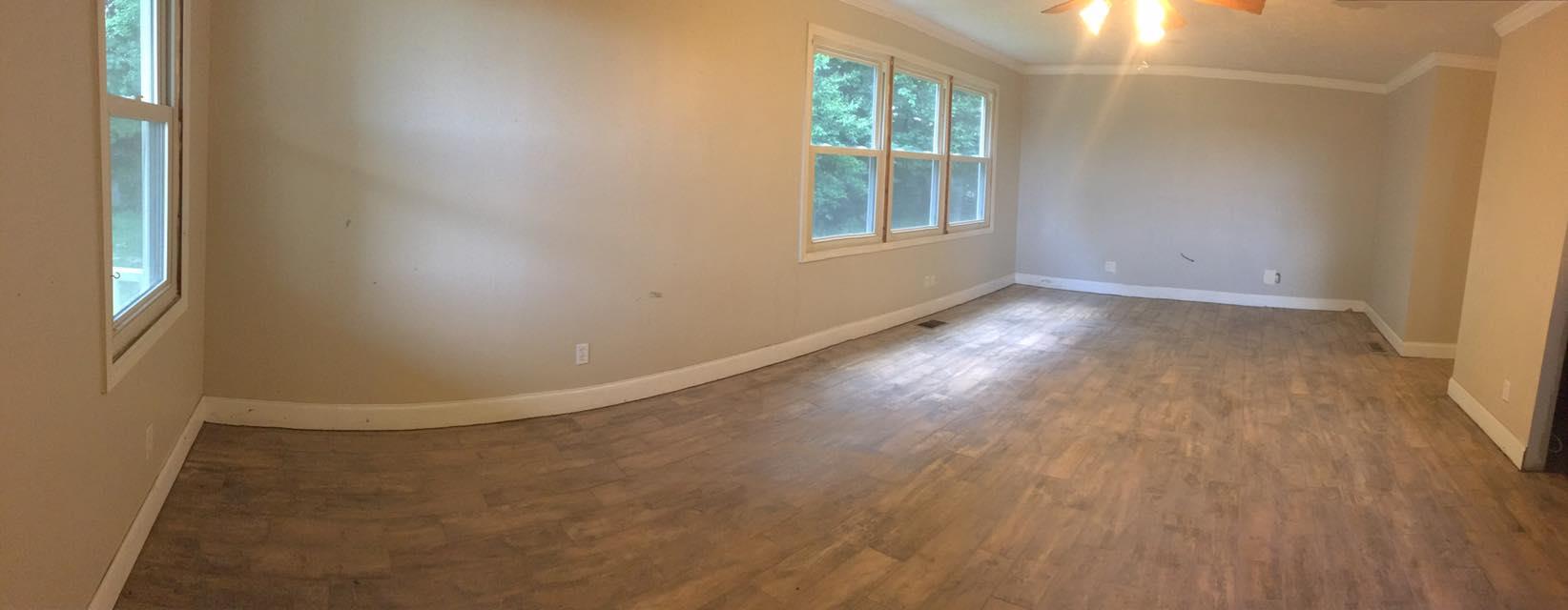3525 Rossview Road Clarksville, TN 37043 - Photo 5 of 18 an empty room with wooden floor and windows