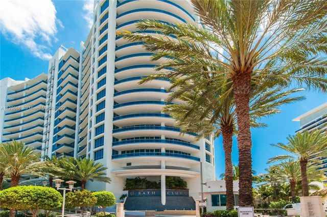 a view of roof with potted plants and palm trees
