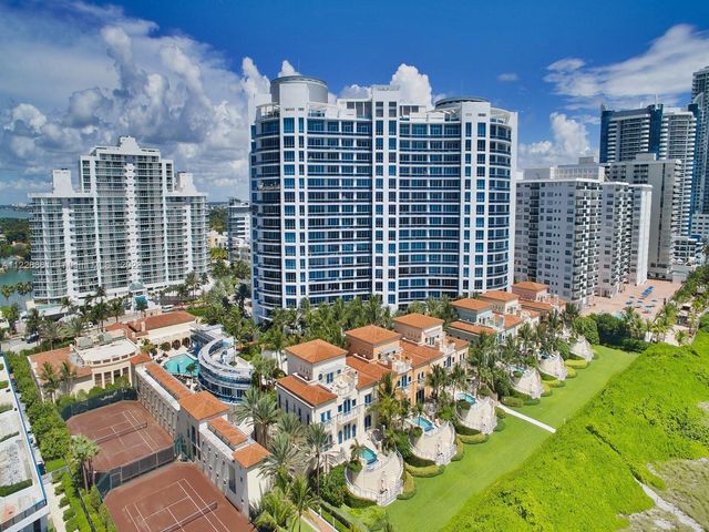 a view of a garden and palm trees
