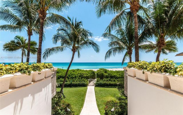 a view of a building with a yard