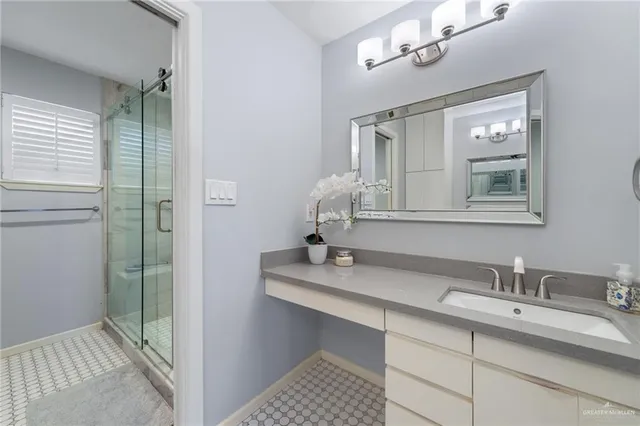 a bathroom with a sink and a mirror