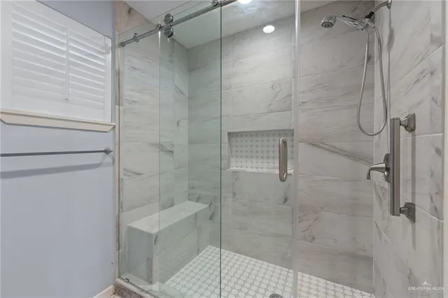 a bathroom with a shower and toilet