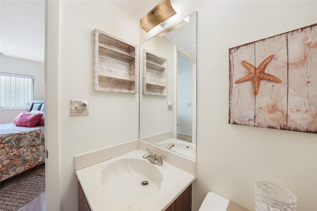 25225 Rampart Boulevard, Unit 1604 Punta Gorda, FL 33983 - Photo 11 of 39 a bathroom with a sink and a mirror