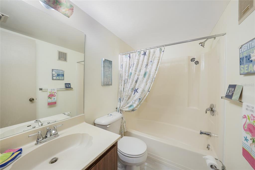 25225 Rampart Boulevard, Unit 1604 Punta Gorda, FL 33983 - Photo 20 of 39 a bathroom with a sink toilet and shower