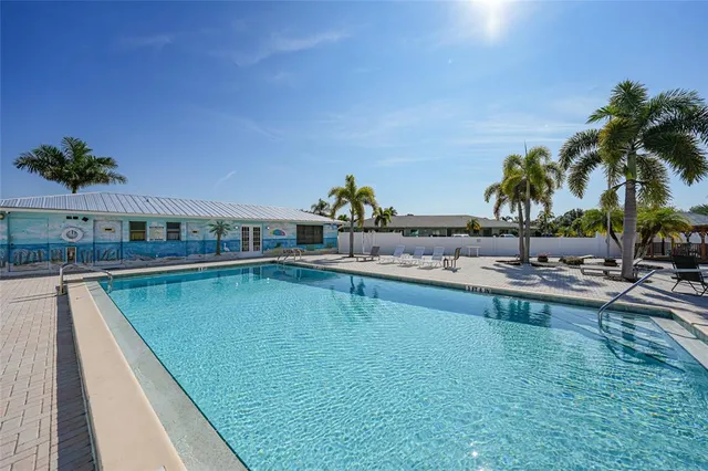 a view of swimming pool with chairs