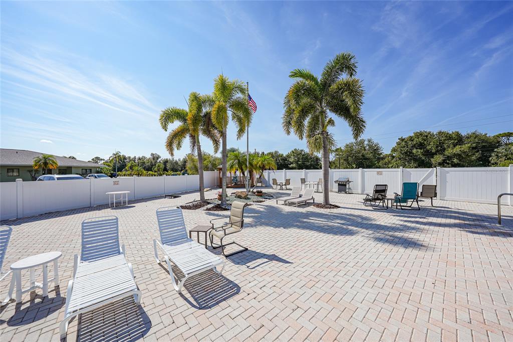 25225 Rampart Boulevard, Unit 1604 Punta Gorda, FL 33983 - Photo 30 of 39 a view of a patio with couches and chairs