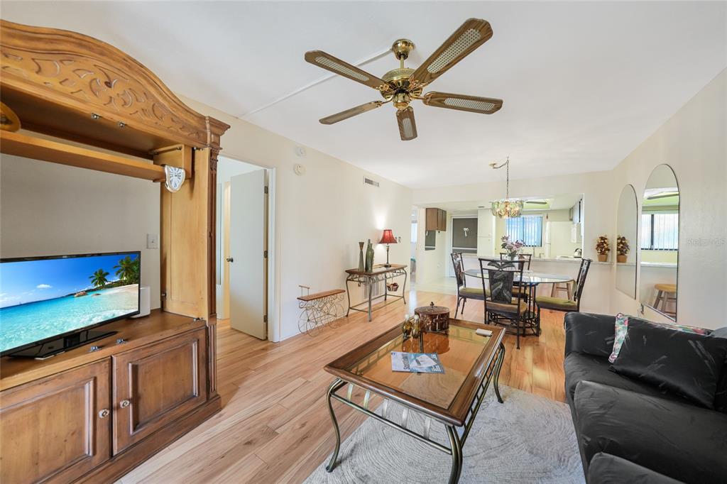 25225 Rampart Boulevard, Unit 1604 Punta Gorda, FL 33983 - Photo 3 of 39 a living room with furniture and a flat screen tv