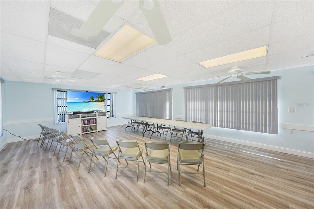 25225 Rampart Boulevard, Unit 1604 Punta Gorda, FL 33983 - Photo 32 of 39 a view of a dining room with furniture and wooden floor