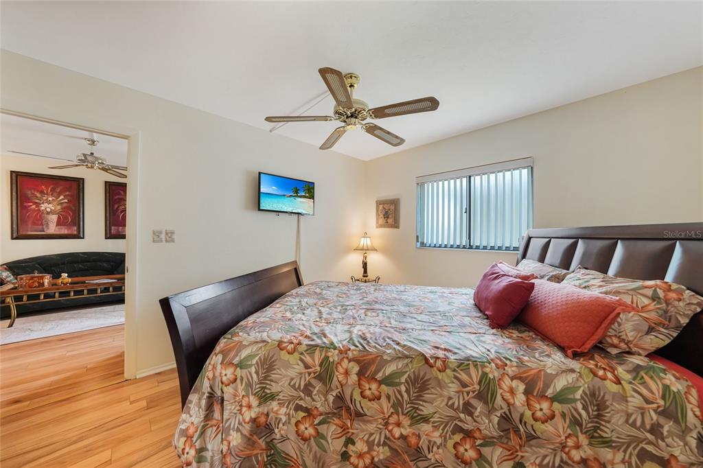 25225 Rampart Boulevard, Unit 1604 Punta Gorda, FL 33983 - Photo 9 of 39 a bedroom with a bed and a tv on table