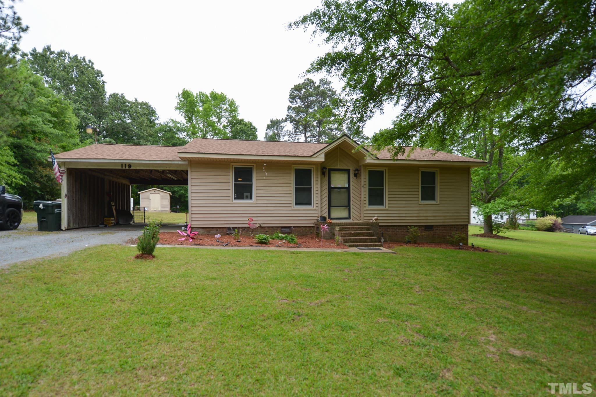 119 Mt Pleasant Road Willow Spring, NC 27592 - Photo 1 of 22 a view of a house with a backyard