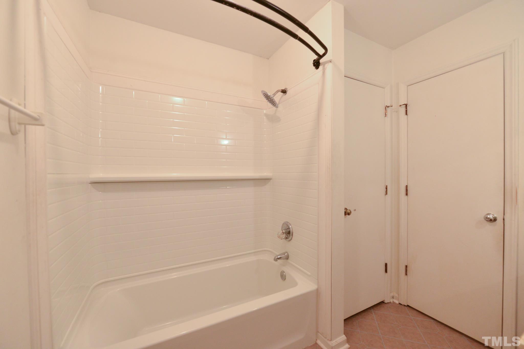 119 Mt Pleasant Road Willow Spring, NC 27592 - Photo 16 of 22 a bathroom with a bathtub and a shower