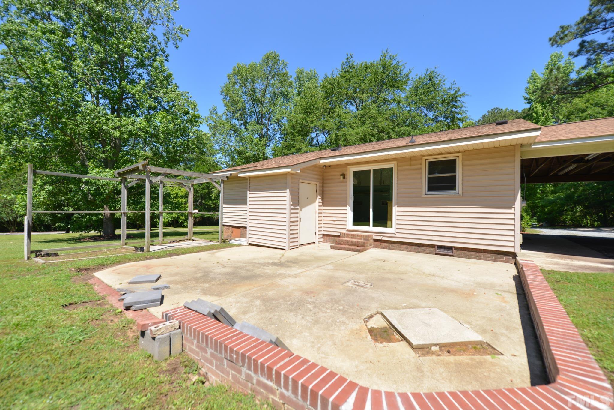 119 Mt Pleasant Road Willow Spring, NC 27592 - Photo 20 of 22 a view of a backyard with a patio
