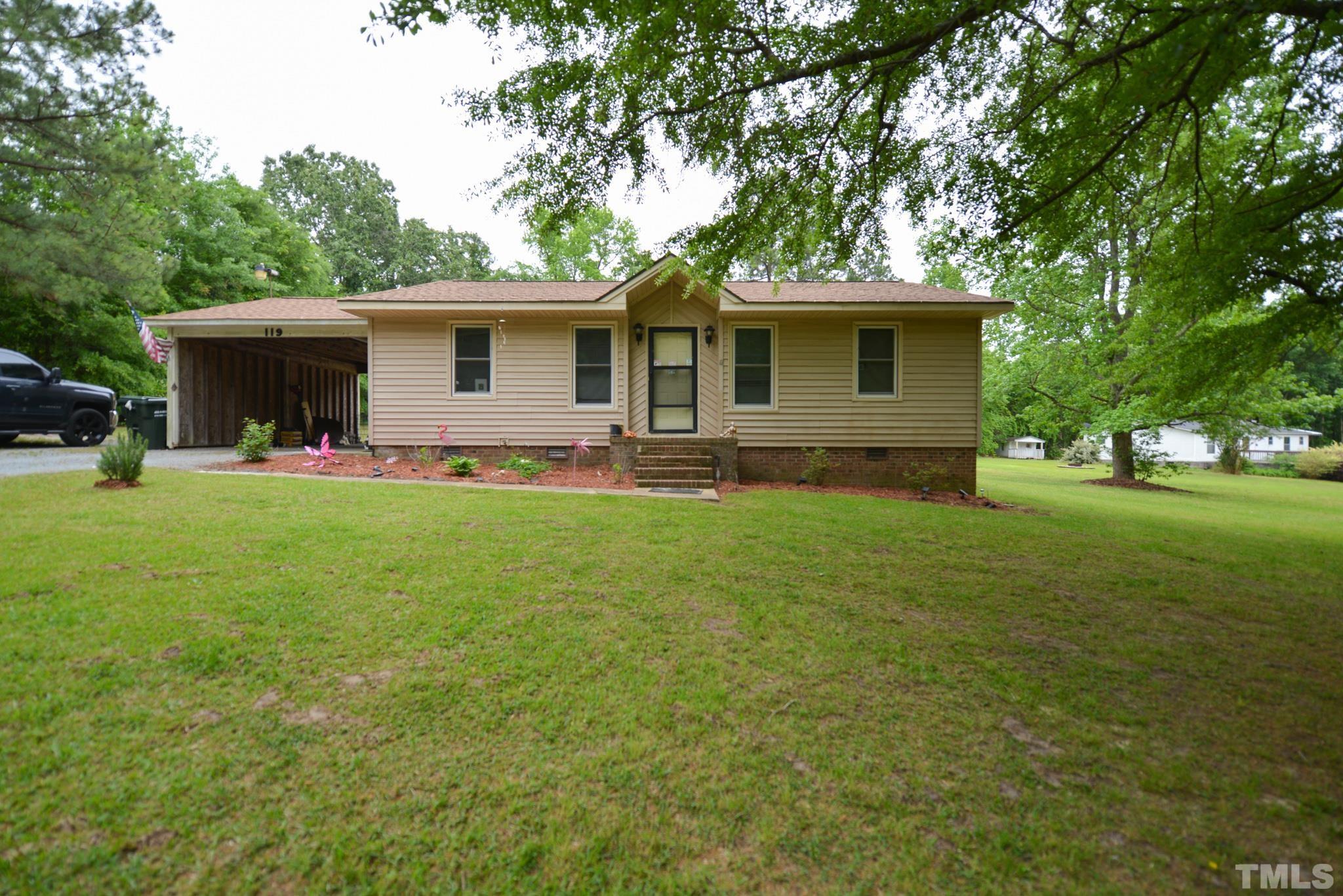 119 Mt Pleasant Road Willow Spring, NC 27592 - Photo 2 of 22 a front view of house with yard and green space