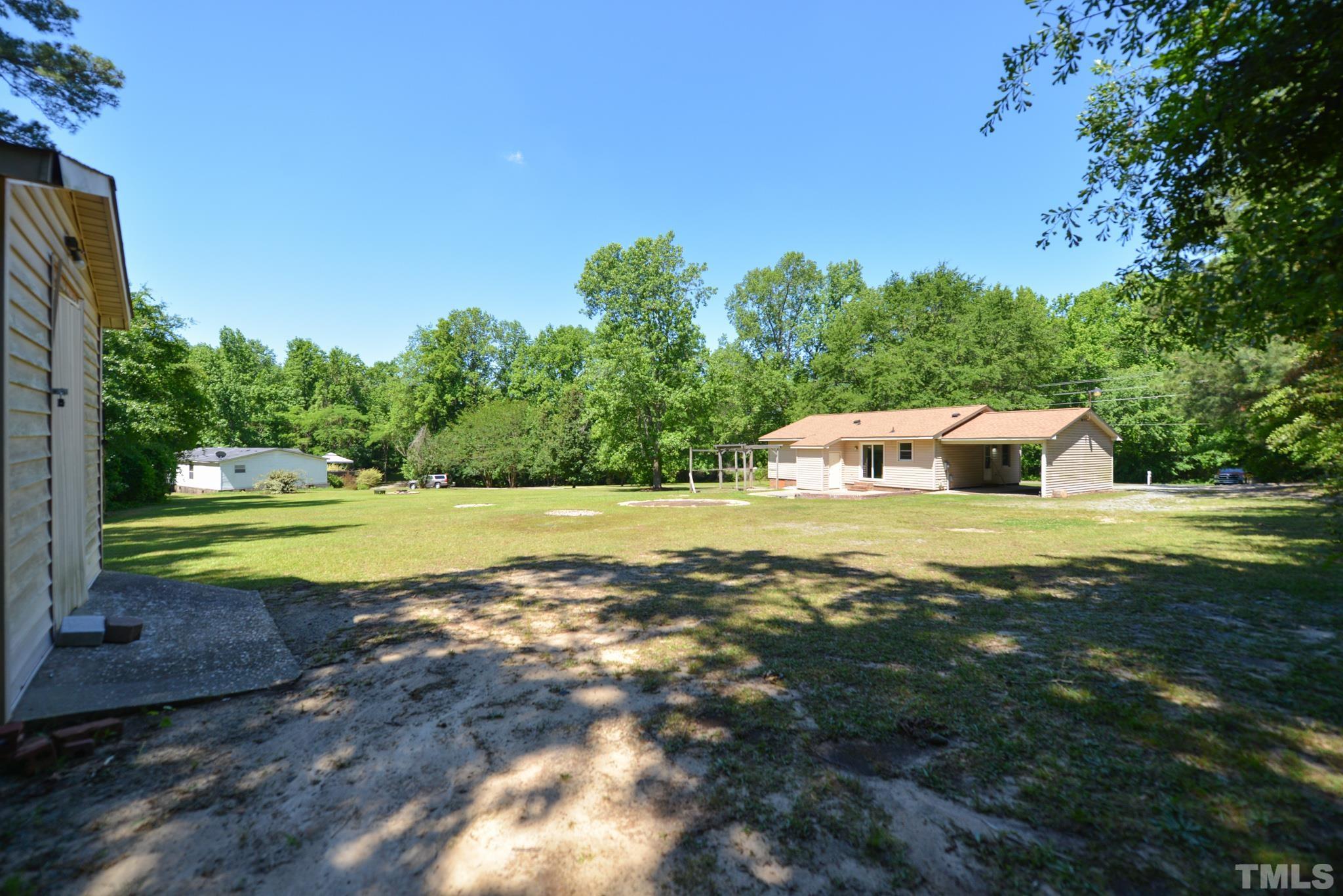 119 Mt Pleasant Road Willow Spring, NC 27592 - Photo 22 of 22 a view of a house with a yard