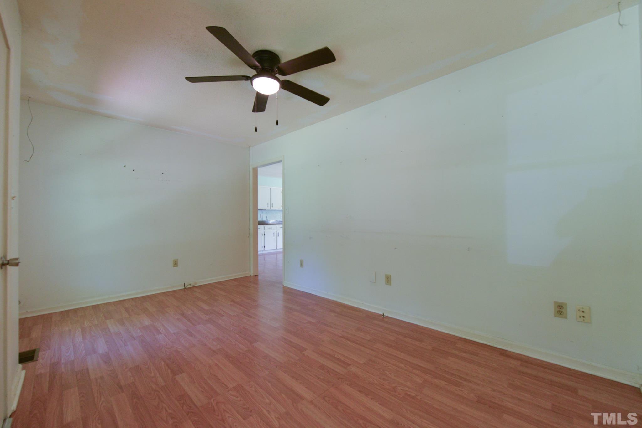 119 Mt Pleasant Road Willow Spring, NC 27592 - Photo 5 of 22 wooden floor in an empty room