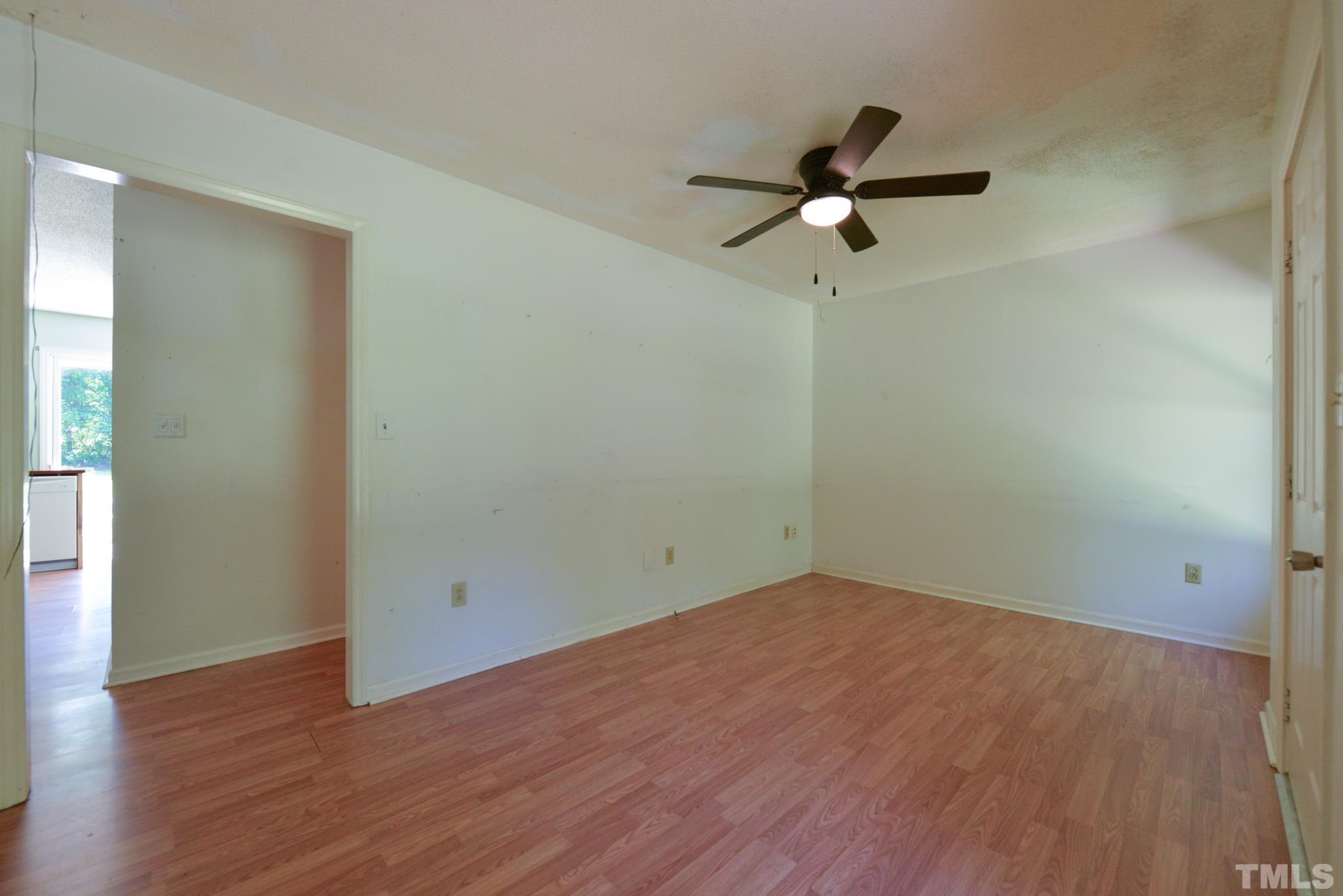 119 Mt Pleasant Road Willow Spring, NC 27592 - Photo 6 of 22 a view of empty room with wooden floor