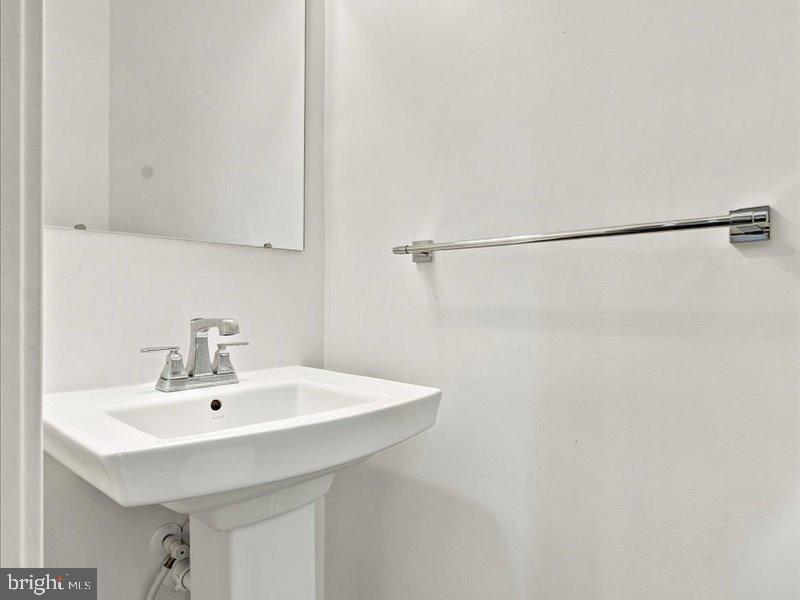 711 Quarry Point Road Malvern, PA 19355 - Photo 11 of 15 Sleek and modern powder room design.