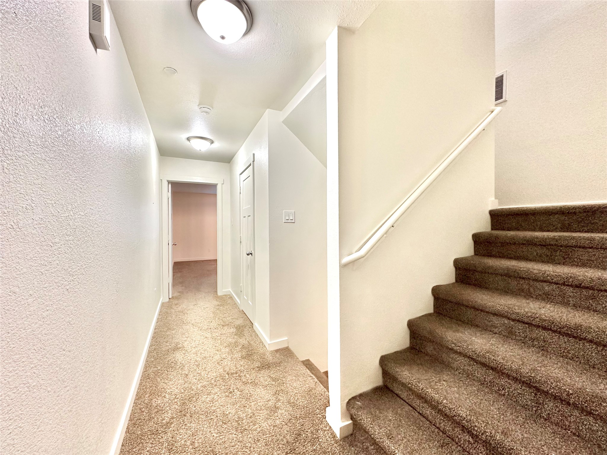 21155 Gosling Road, Unit 6C Spring, TX 77388 - Photo 12 of 20 (Second floor) Hallway showing door to half bath for guest.