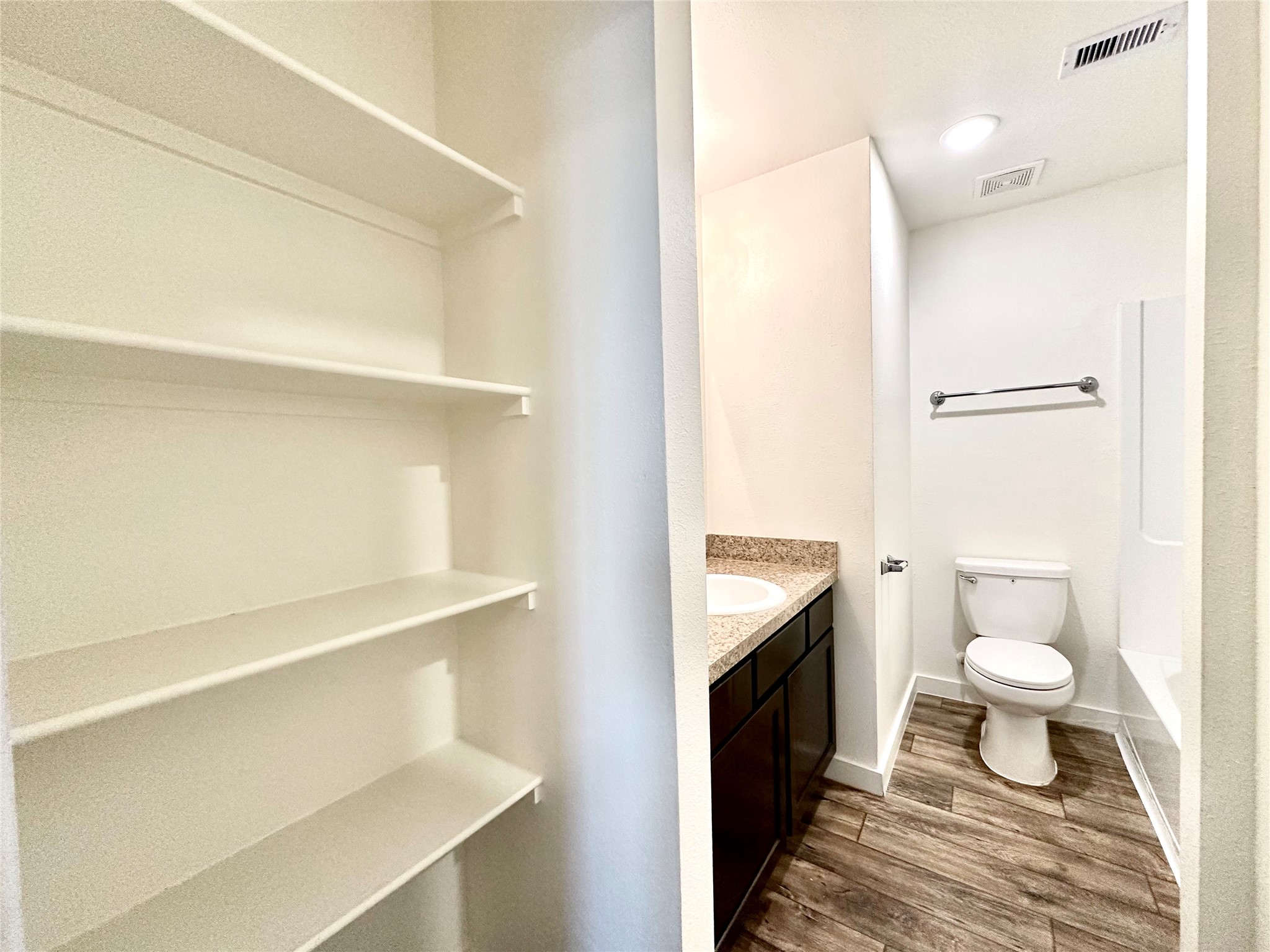 21155 Gosling Road, Unit 6C Spring, TX 77388 - Photo 14 of 20 (Third-floor) Spacious secondary bathroom with ample cabinet space and extra shelves for storage.
