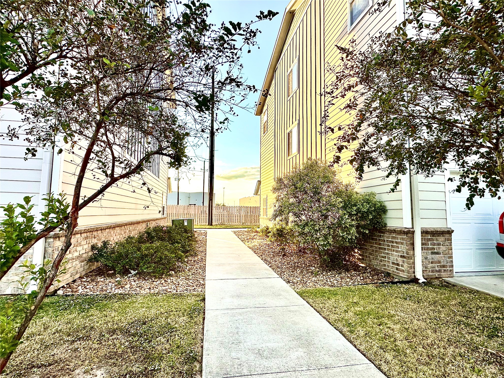 21155 Gosling Road, Unit 6C Spring, TX 77388 - Photo 2 of 20 Spacious walkway to large parking lot with ample space for your guest. House also has one car attached garage with additional driveway. Space (tandem). Lots of room!