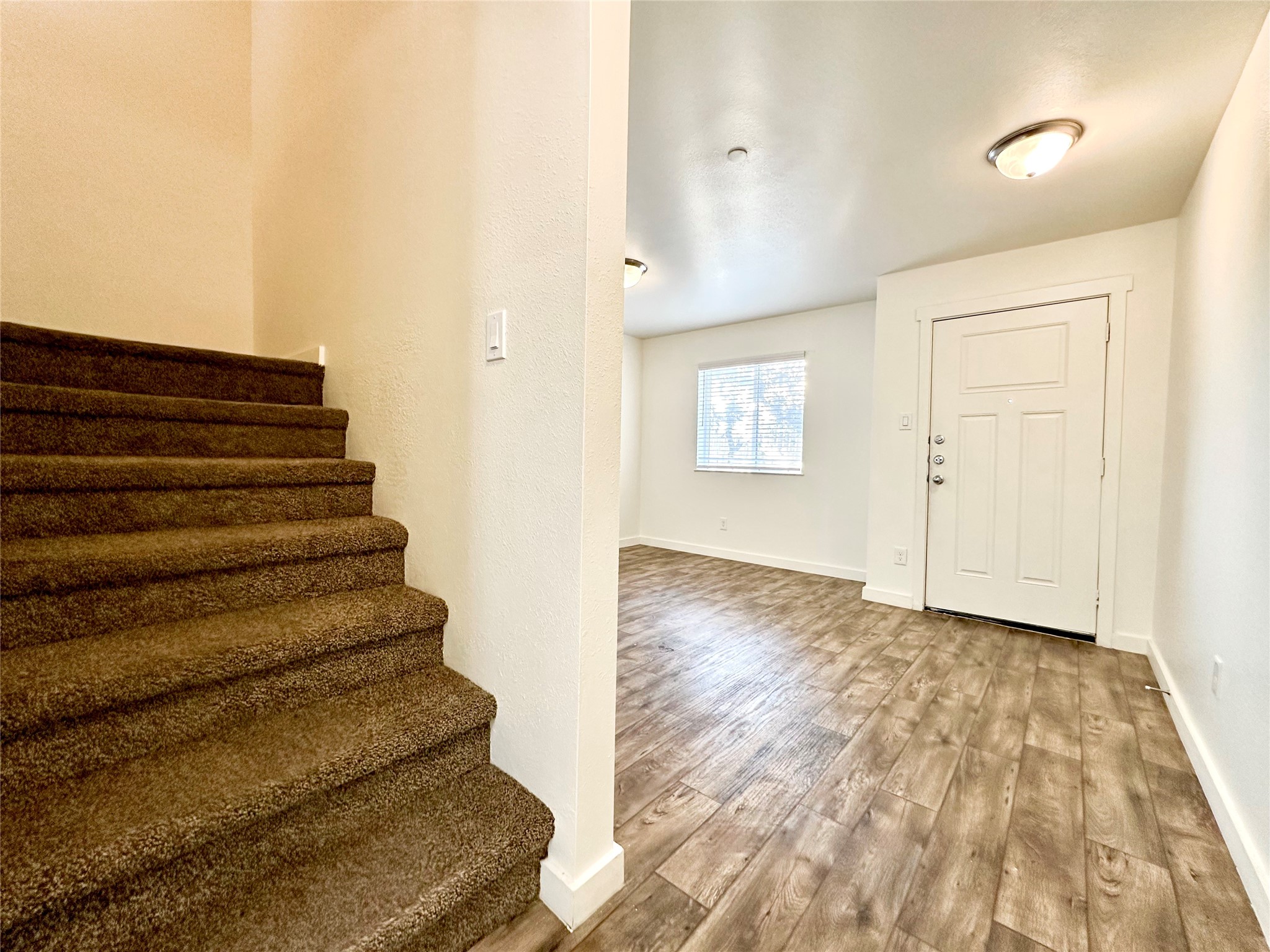 21155 Gosling Road, Unit 6C Spring, TX 77388 - Photo 5 of 20 (First Floor) View of the front door, living room, and stairs to the second floor.