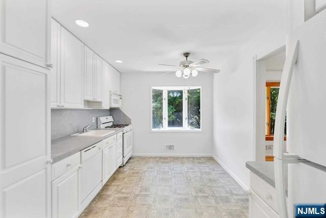 516 Knickerbocker Road Cresskill, NJ 07626 - Photo 6 of 31 a kitchen with sink and cabinets