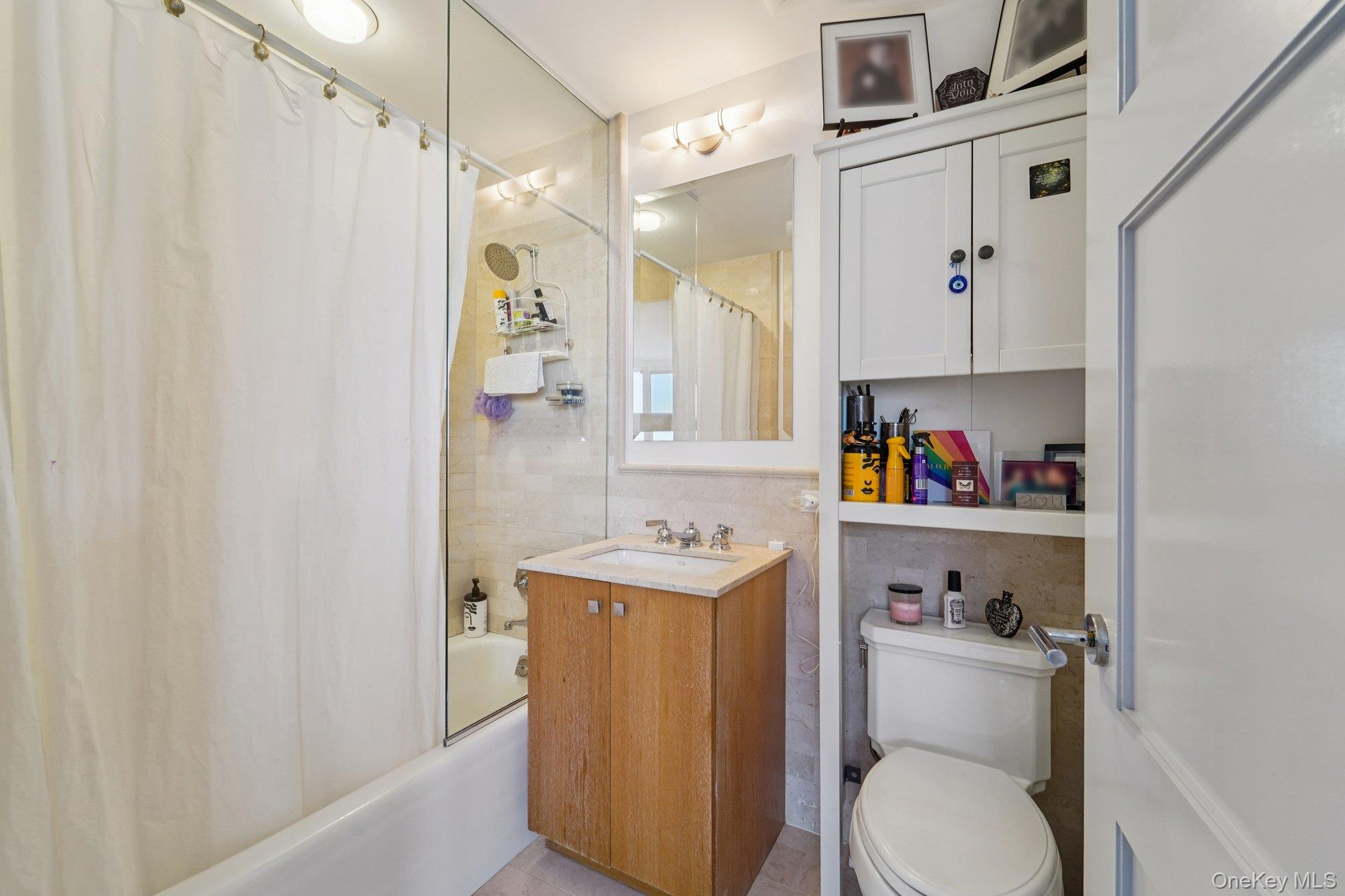 1 Renaissance Square, Unit 25G White Plains, NY 10601 - Photo 15 of 23 a bathroom with a sink toilet vanity and tub