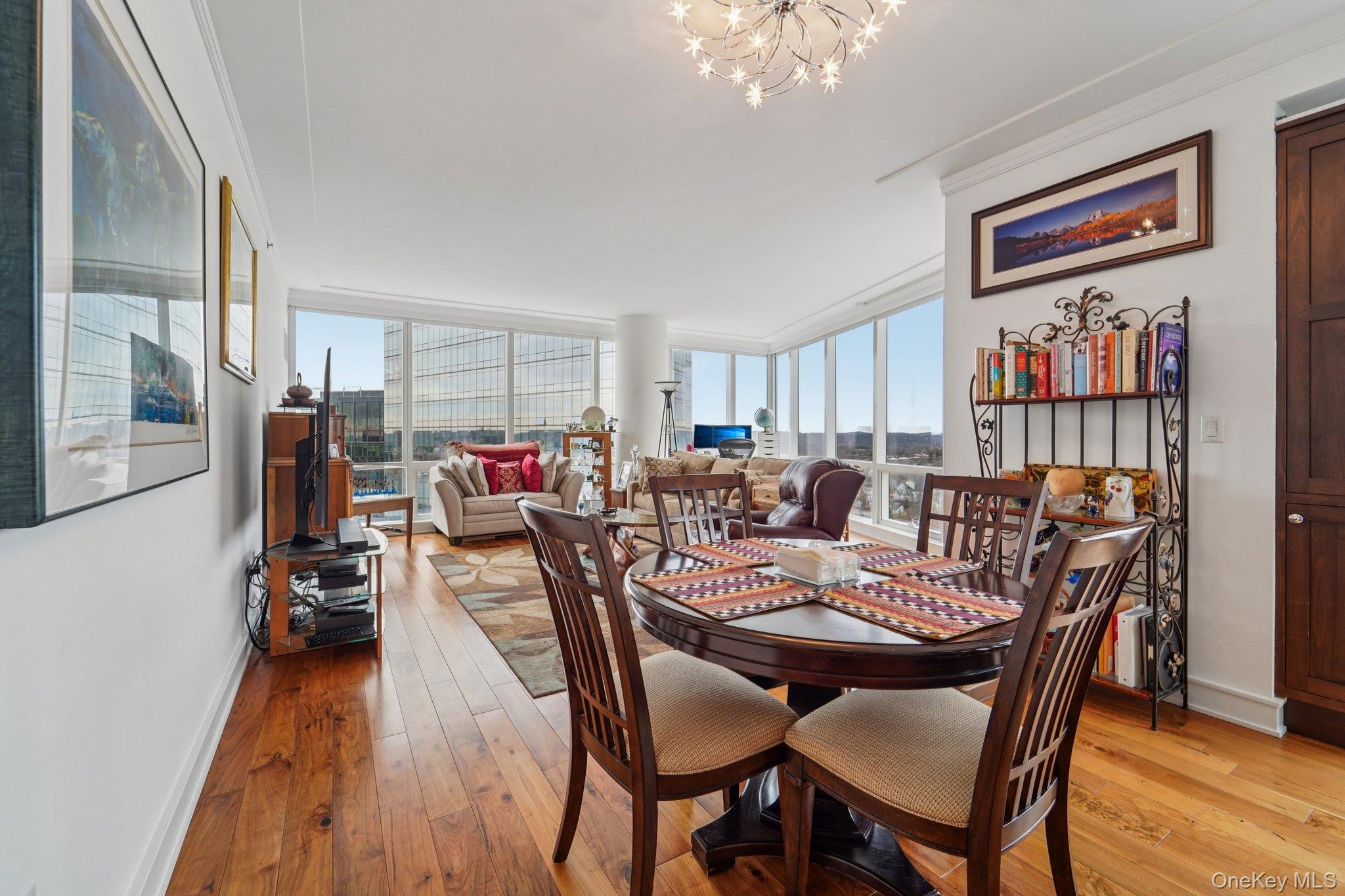 1 Renaissance Square, Unit 25G White Plains, NY 10601 - Photo 3 of 23 a view of a dining room with furniture window and wooden floor