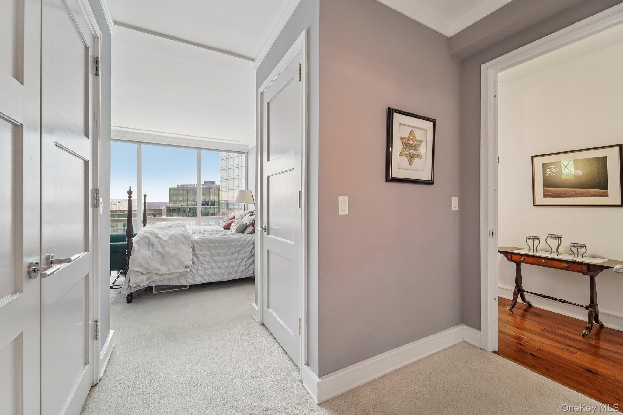 1 Renaissance Square, Unit 25G White Plains, NY 10601 - Photo 8 of 23 a bedroom with a bed and a view of bathroom