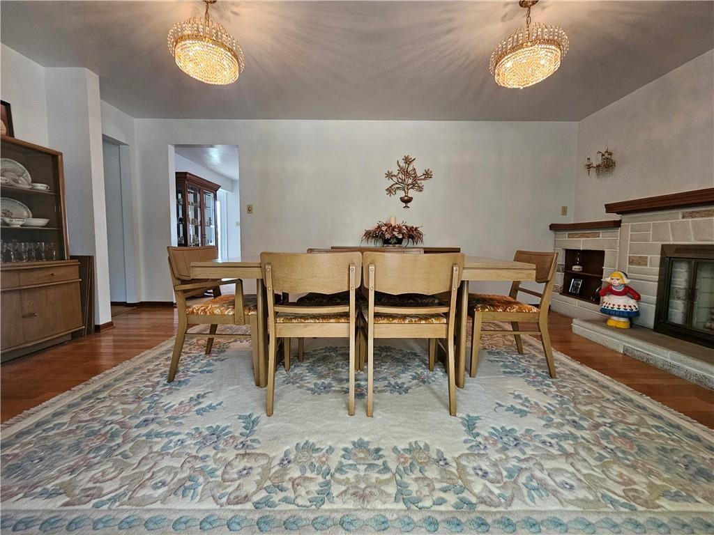 412 Cole Road Sarver, PA 16055 - Photo 13 of 48 a living room with furniture a fireplace and a flat screen tv