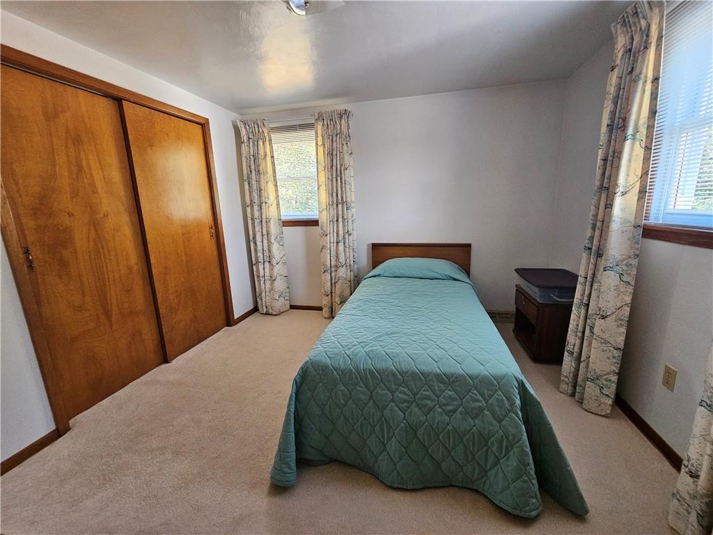 412 Cole Road Sarver, PA 16055 - Photo 24 of 48 a bedroom with a bed a mirror and a window
