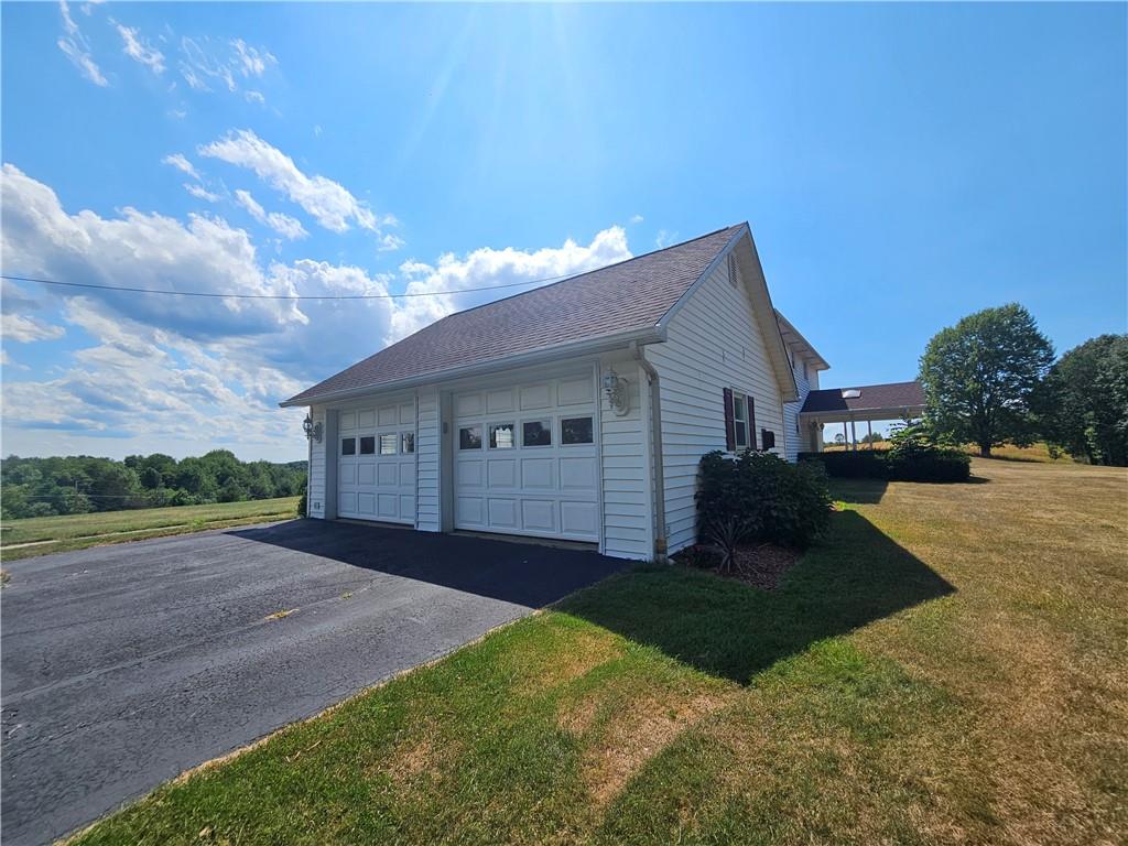412 Cole Road Sarver, PA 16055 - Photo 4 of 48 a front view of a house with a yard and garage