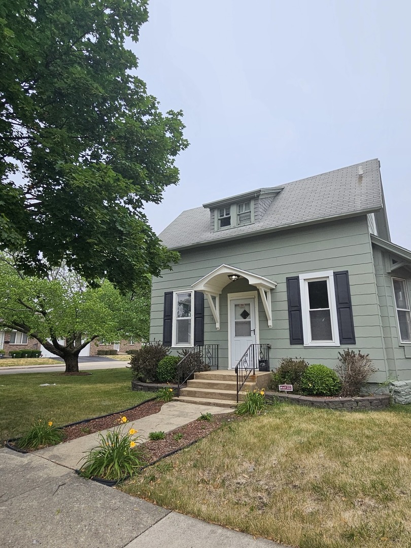 825 Black Road Joliet, IL 60435 - Photo 1 of 22 a front view of a house with a yard