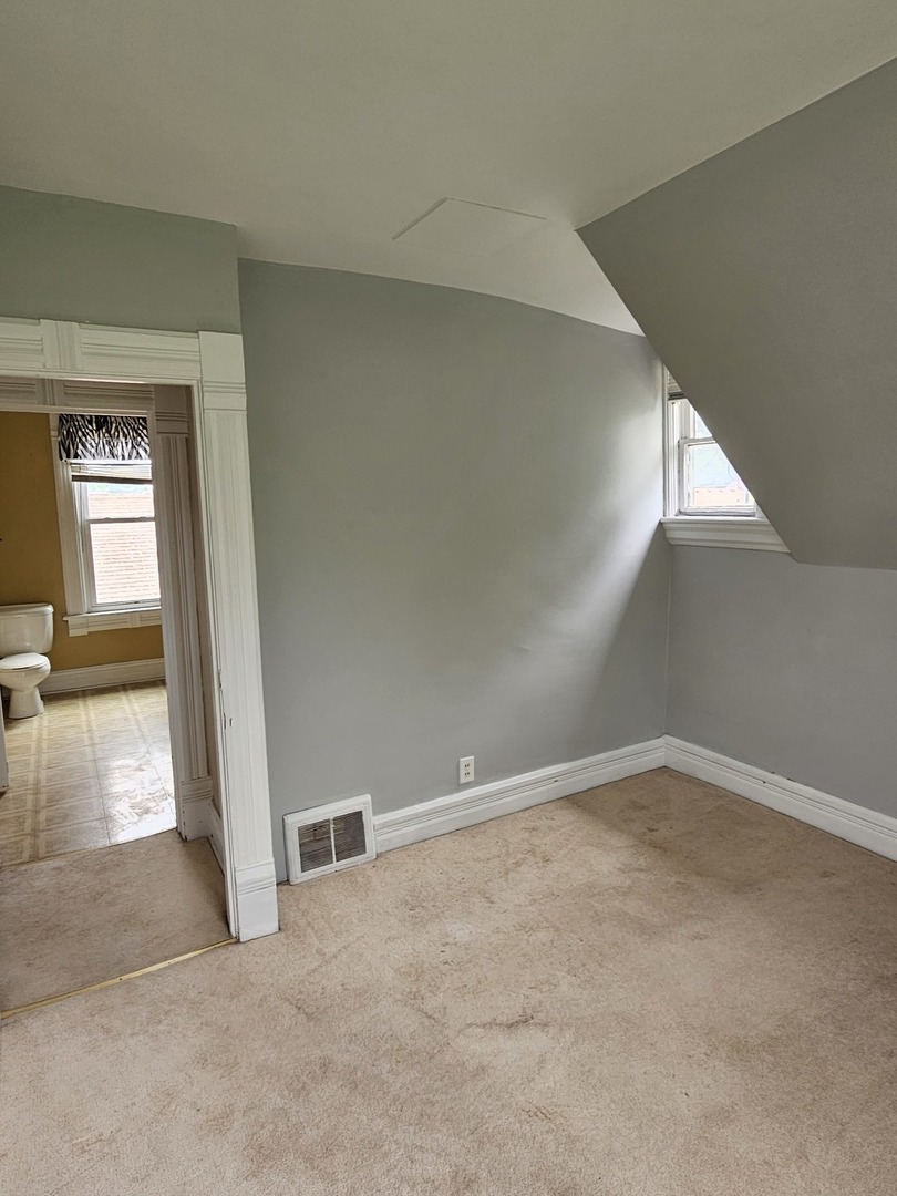 825 Black Road Joliet, IL 60435 - Photo 18 of 22 an empty room with windows