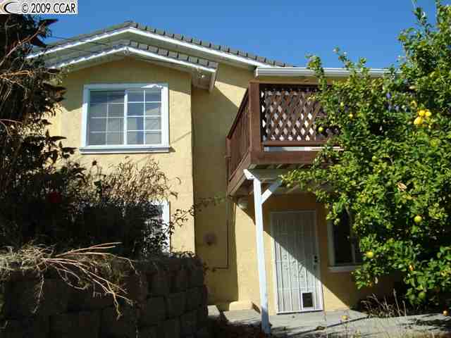 367 Lake Avenue Rodeo, CA 94572 - Photo 1 of 1 a front view of a house with a yard