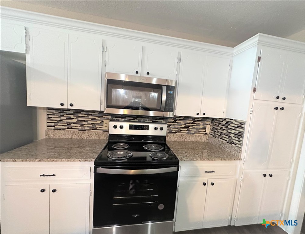 2204 Phyllis Drive Copperas Cove, TX 76522 - Photo 3 of 12 a kitchen with appliances a sink and a stove