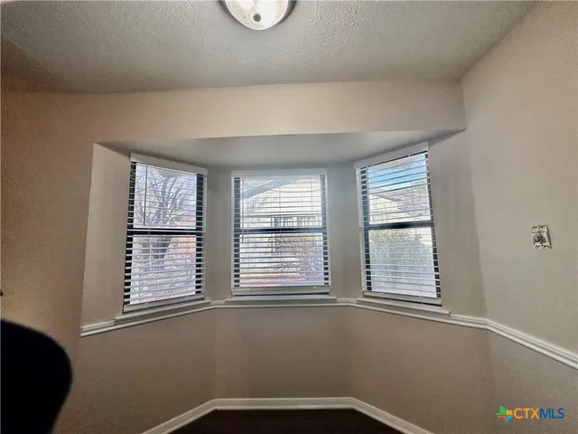 a view of a room that has a window in it