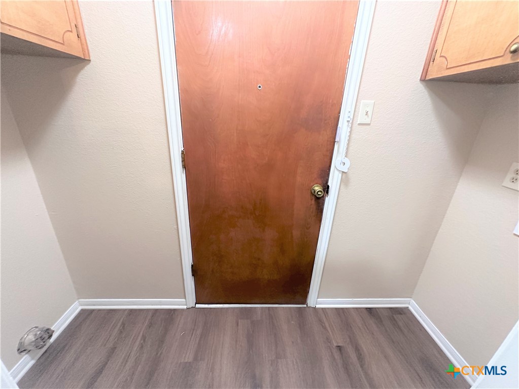 2204 Phyllis Drive Copperas Cove, TX 76522 - Photo 8 of 12 a view of an empty room with wooden floor and a window