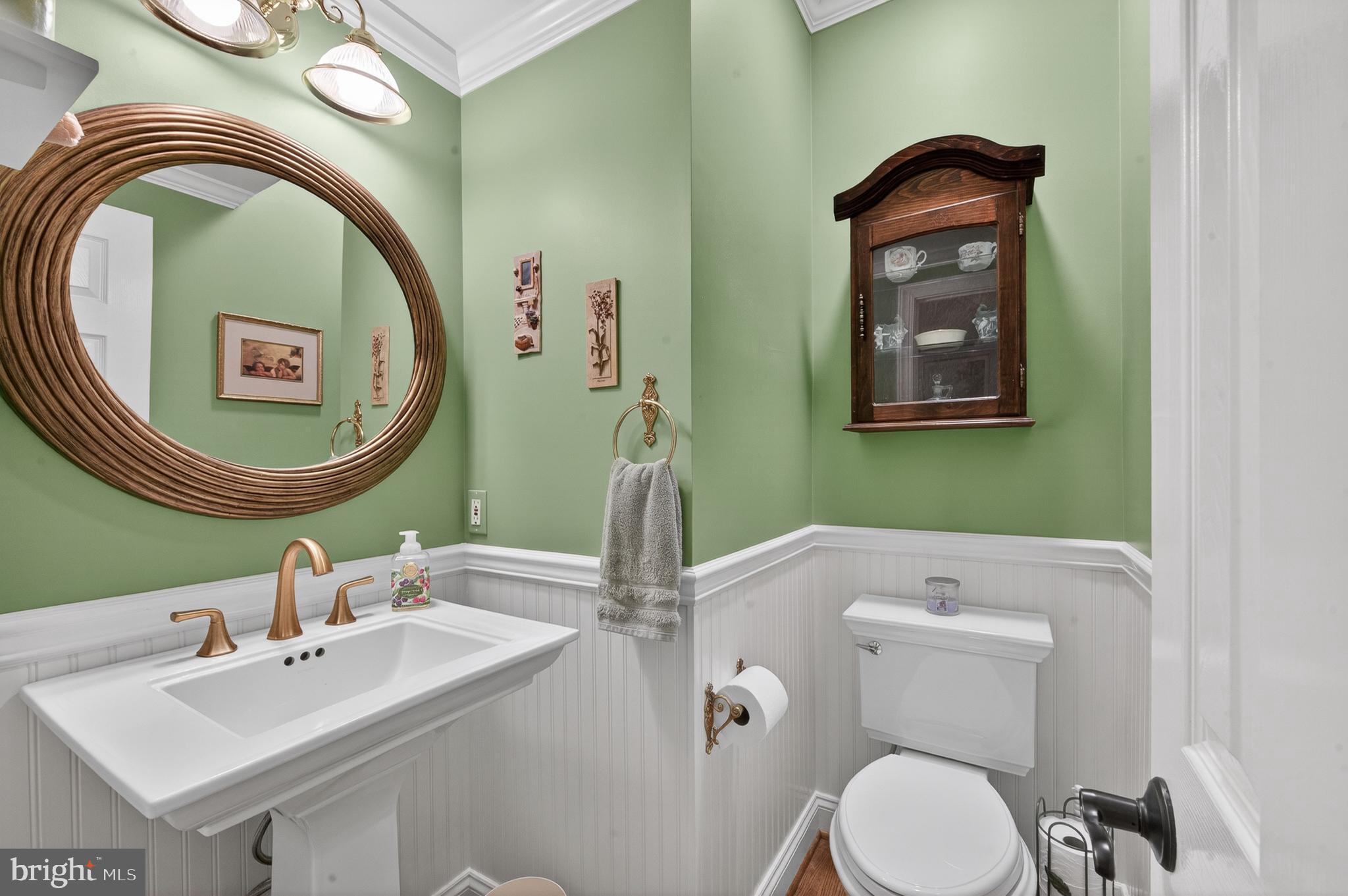 6601 Colchester Road Fairfax Station, VA 22039 - Photo 27 of 78 a bathroom with a toilet sink and mirror